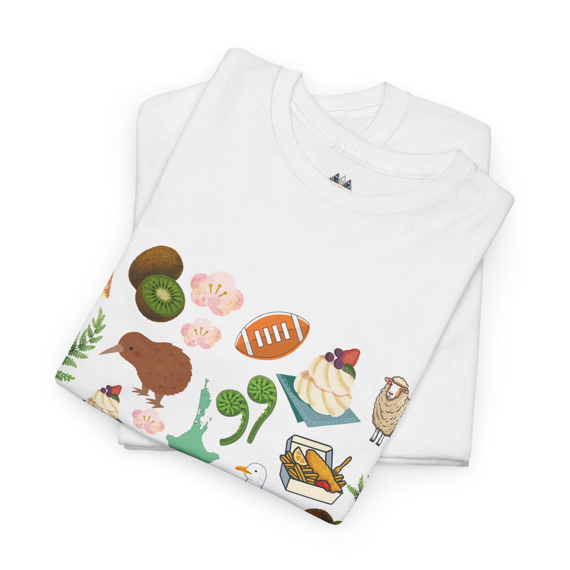 White T-shirt folded with Kiwiana wildlife and plants graphic across front