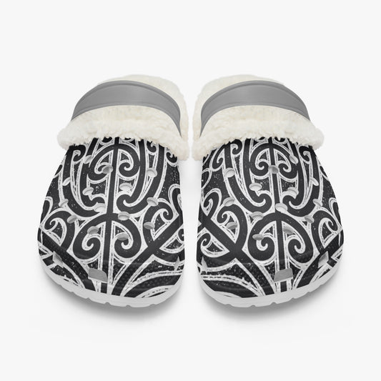 Slip-on clogs in black and white pattern with white faux fur lining