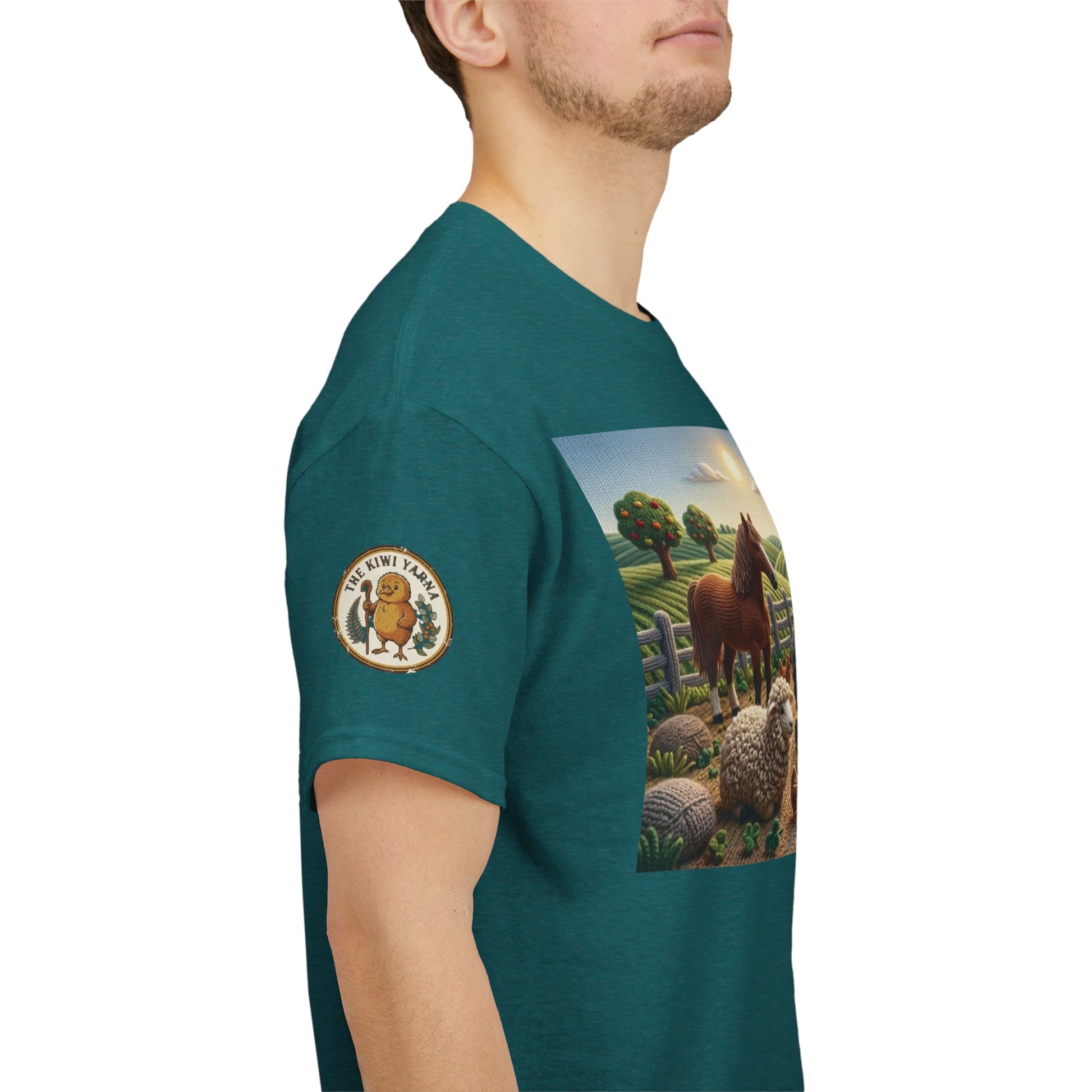 Teal short-sleeve T-shirt with farm scene graphic and round chest logo on sleeve.