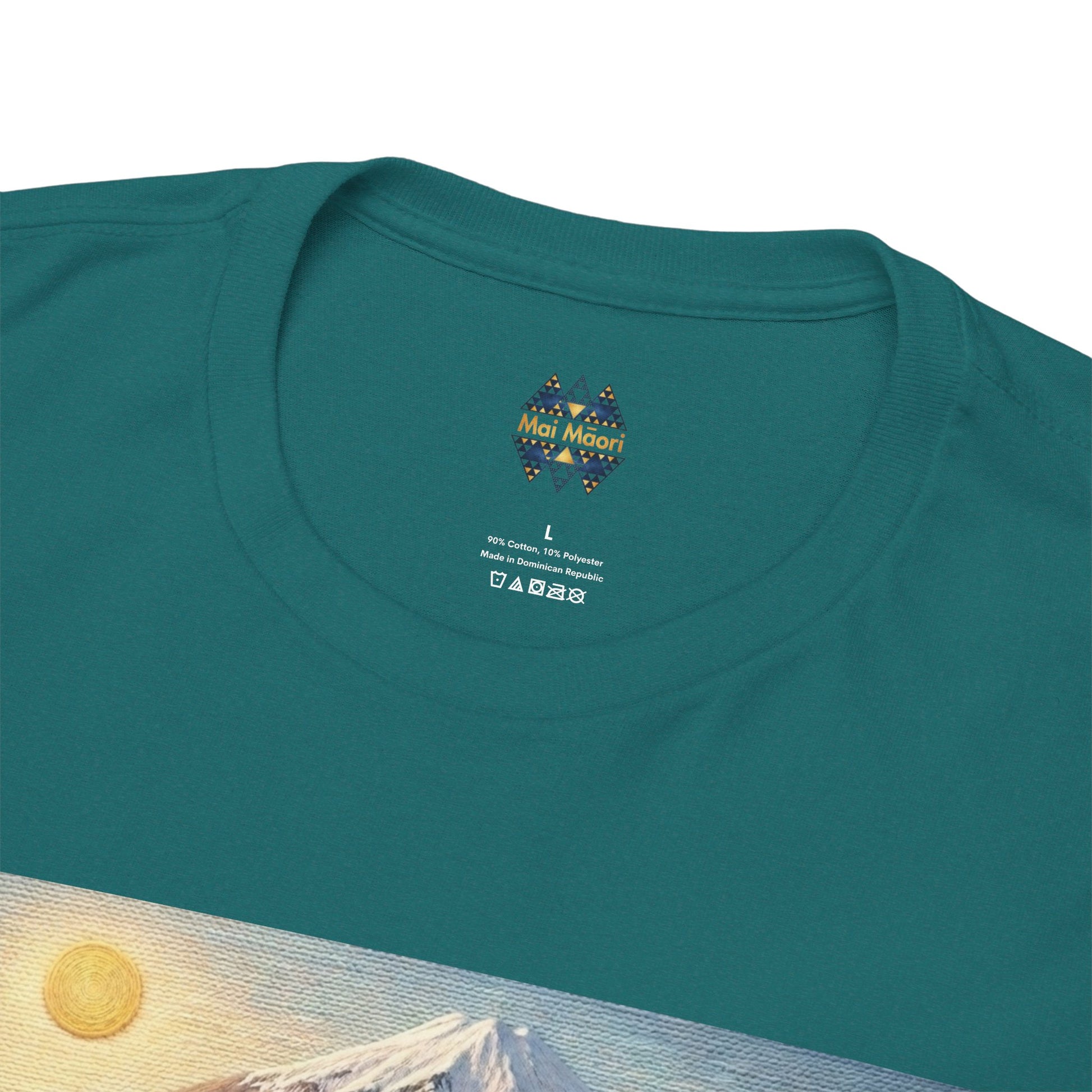 Teal crewneck T-shirt close-up of neckline and small chest logo above the graphic.