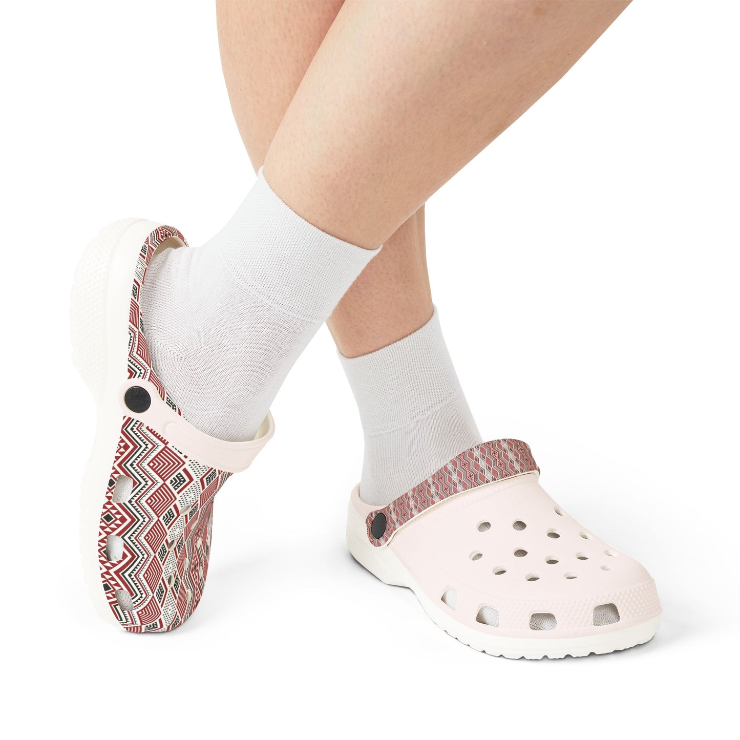 Tāniko clogs worn with white socks; red-and-white patterned upper and vented toe holes