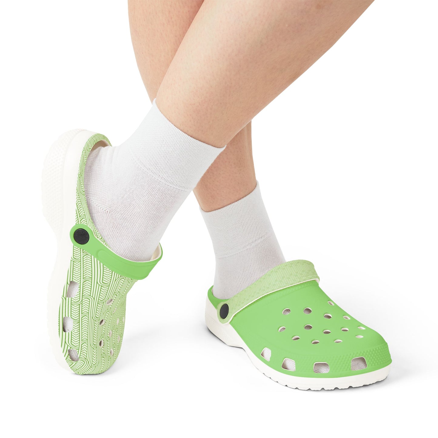 Maoritanga clogs with white socks, green patterned heels and perforated fronts, white sole