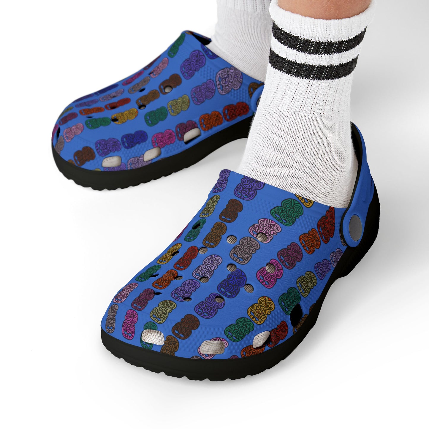 Kids casual clog shoes worn: blue patterned slip-on with black rubber sole and socks