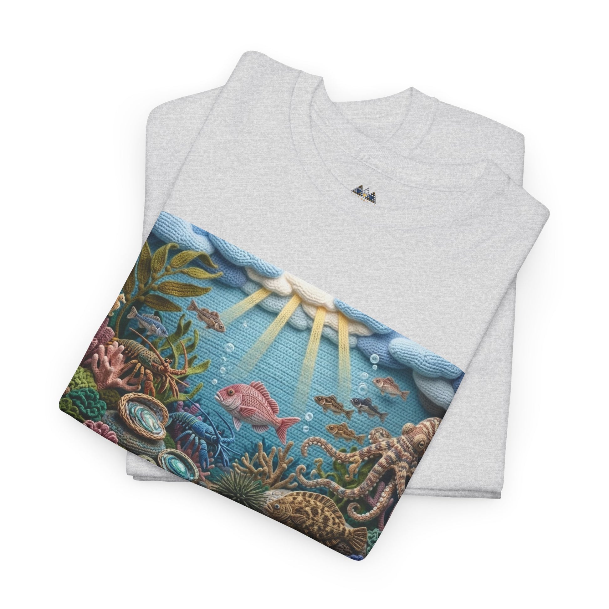 Light gray folded T-shirt with rectangular underwater ocean scene print