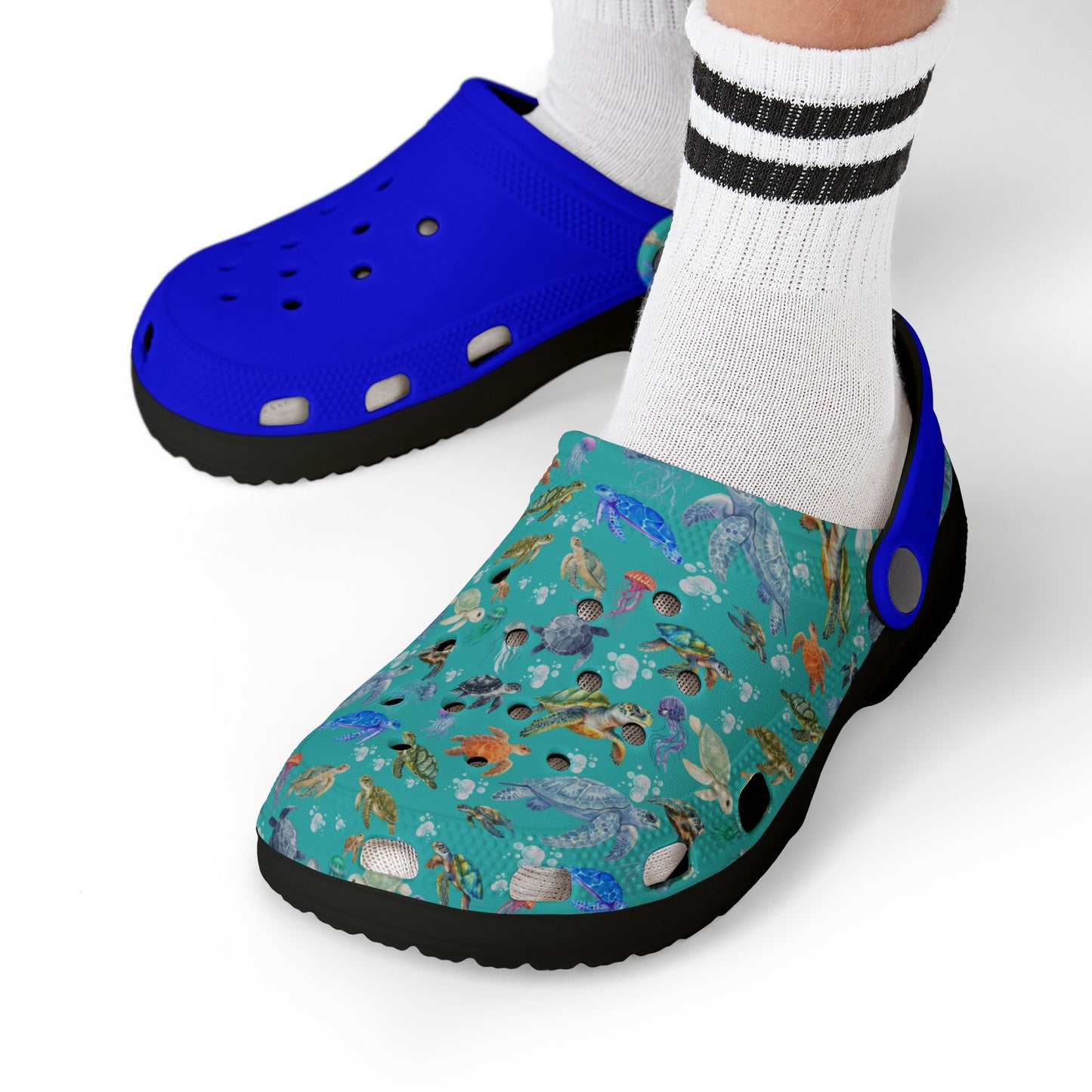 Kids' slip-on clogs with white socks; blue top, teal sea-animal print, black sole.