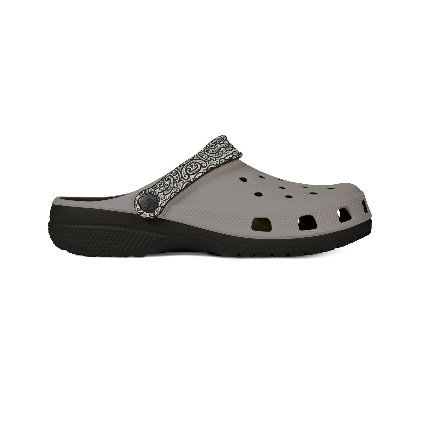 Croc-style clog with light gray perforated footbed and black patterned strap