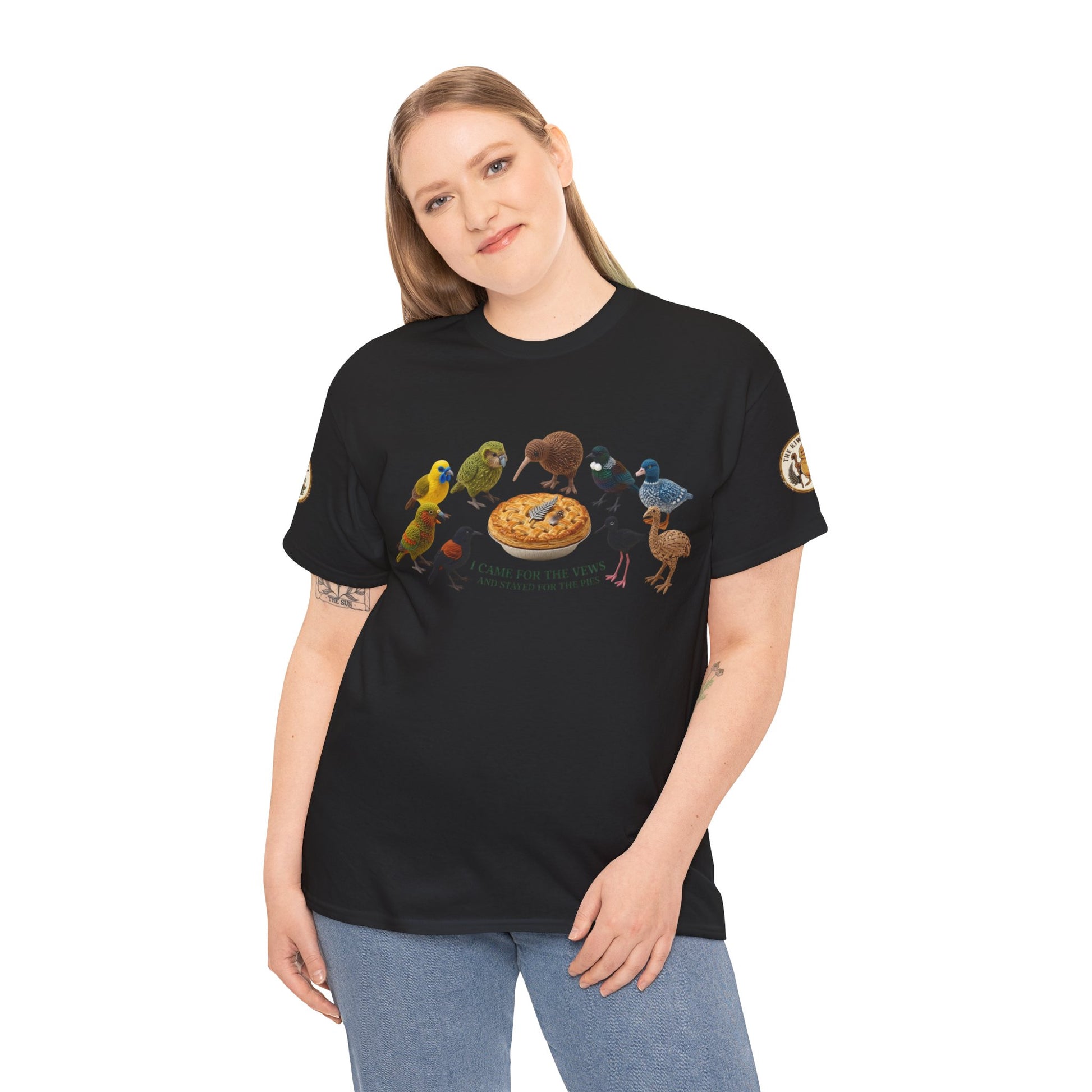 Black T-shirt on model with bird-and-pizza front graphic and small sleeve logo patch.