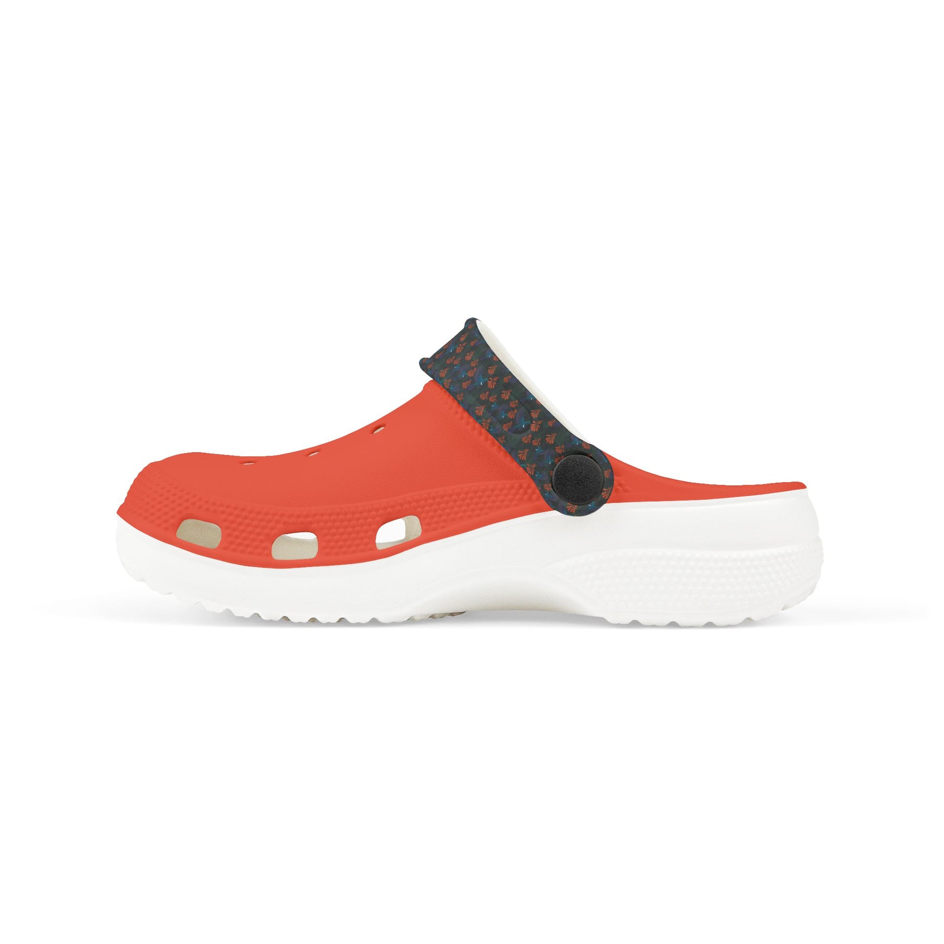 Kids slip-on clogs in orange with dark floral heel panel, round strap, white sole