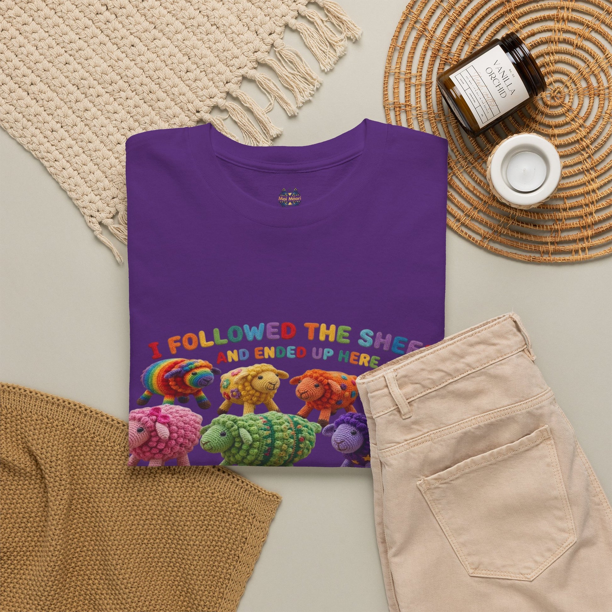 Purple short-sleeve T-shirt with colorful sheep graphic and round neckline