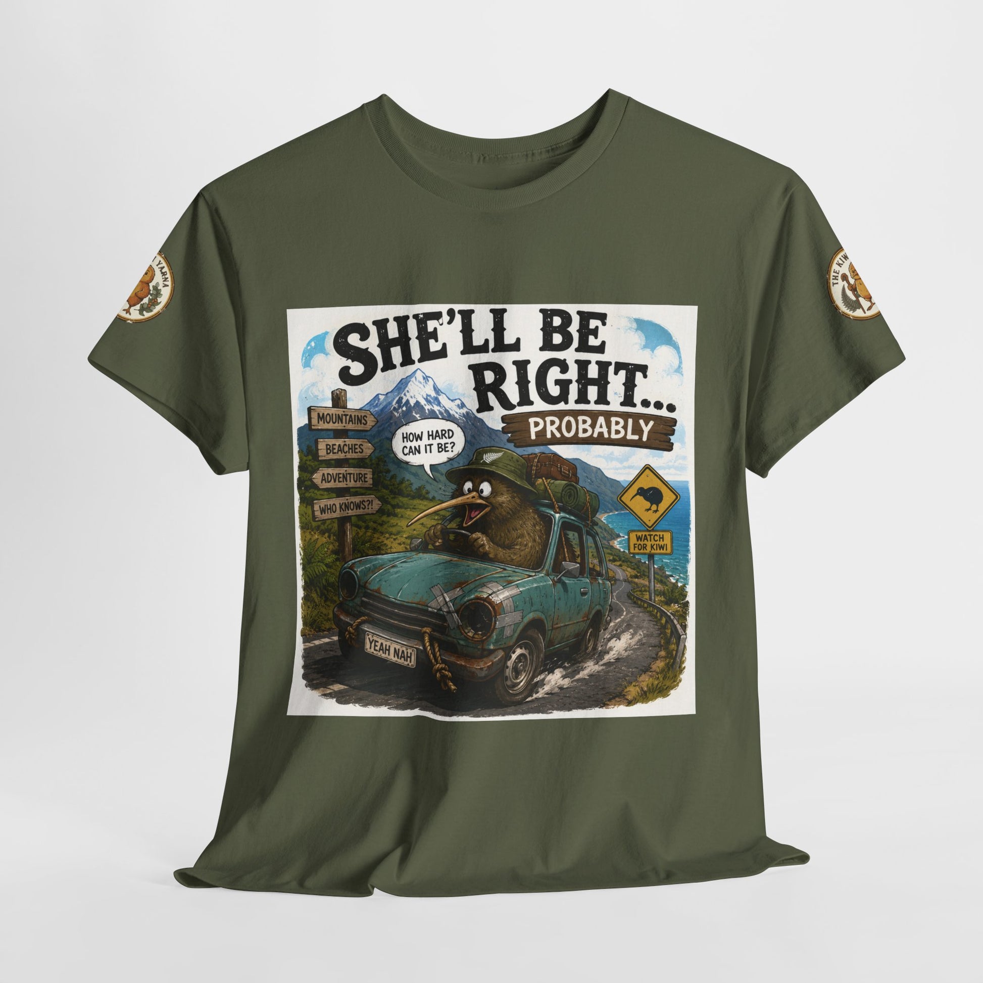 Dark green crew-neck T-shirt with “She’ll Be Right… Probably” front graphic, flat lay.