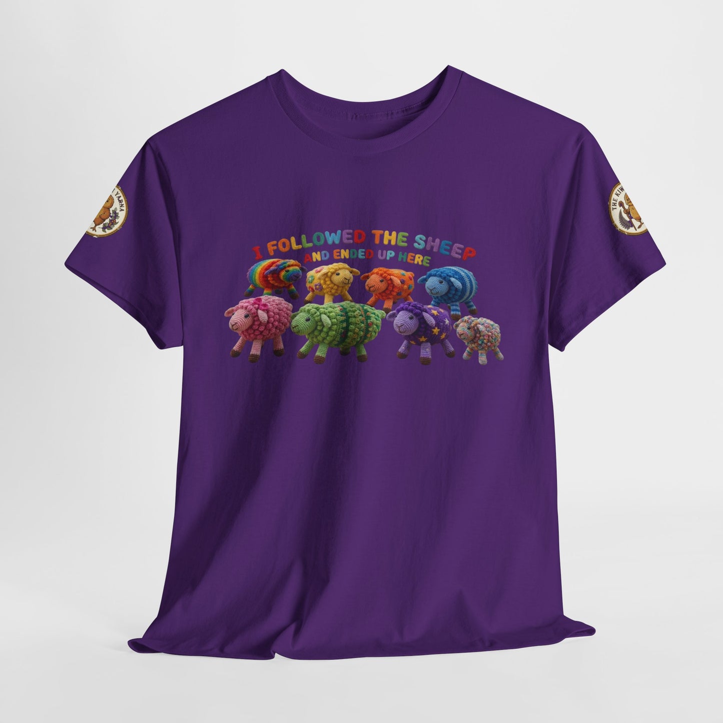 Purple graphic crewneck t-shirt with colorful sheep lineup and multicolor text on front.