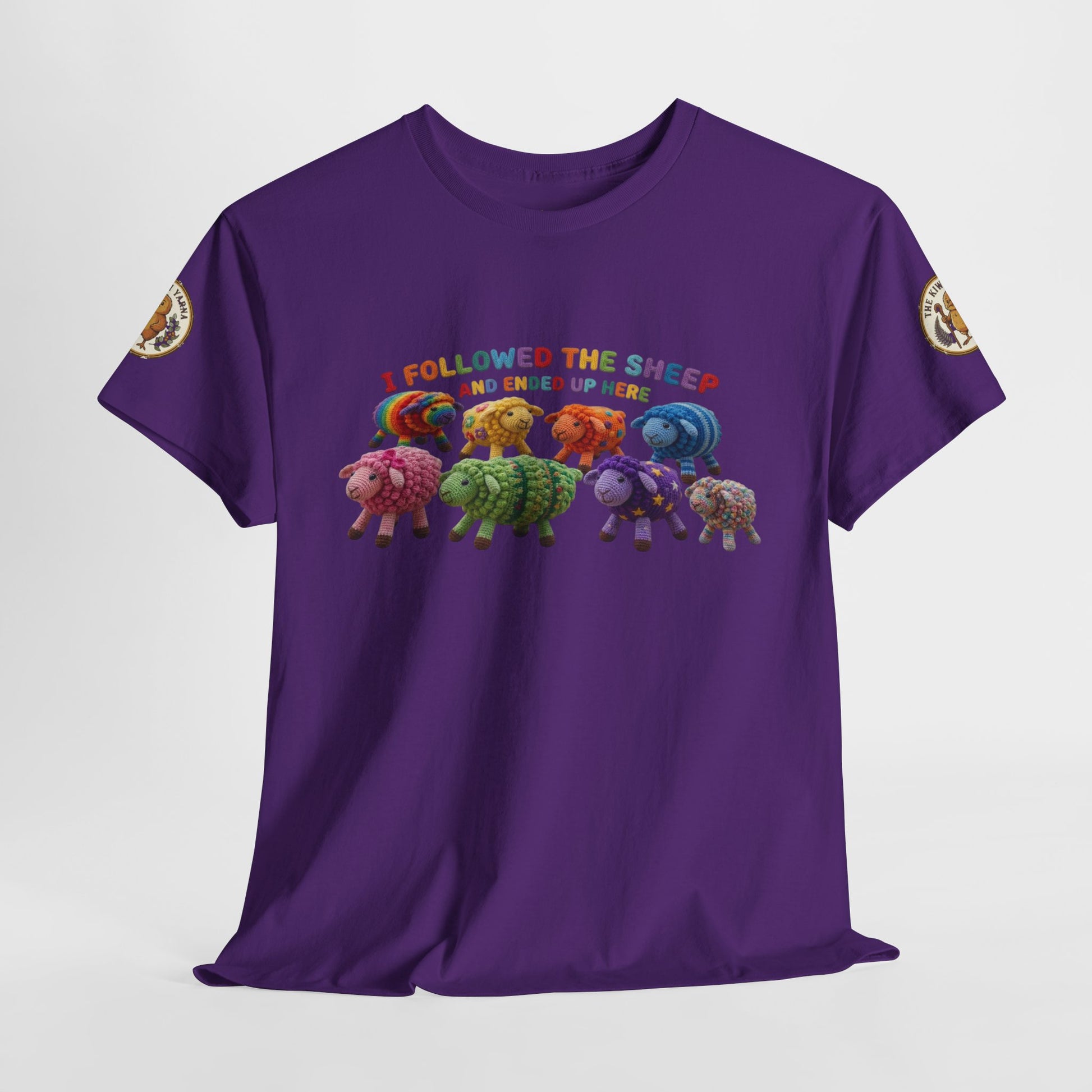 Purple graphic crewneck t-shirt with colorful sheep lineup and multicolor text on front.