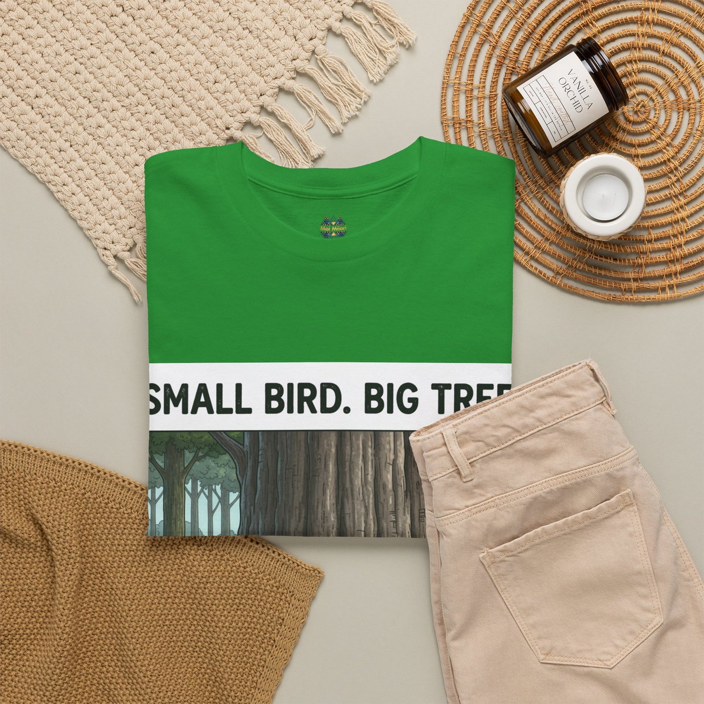 Green T-shirt front graphic panel visible under accessories