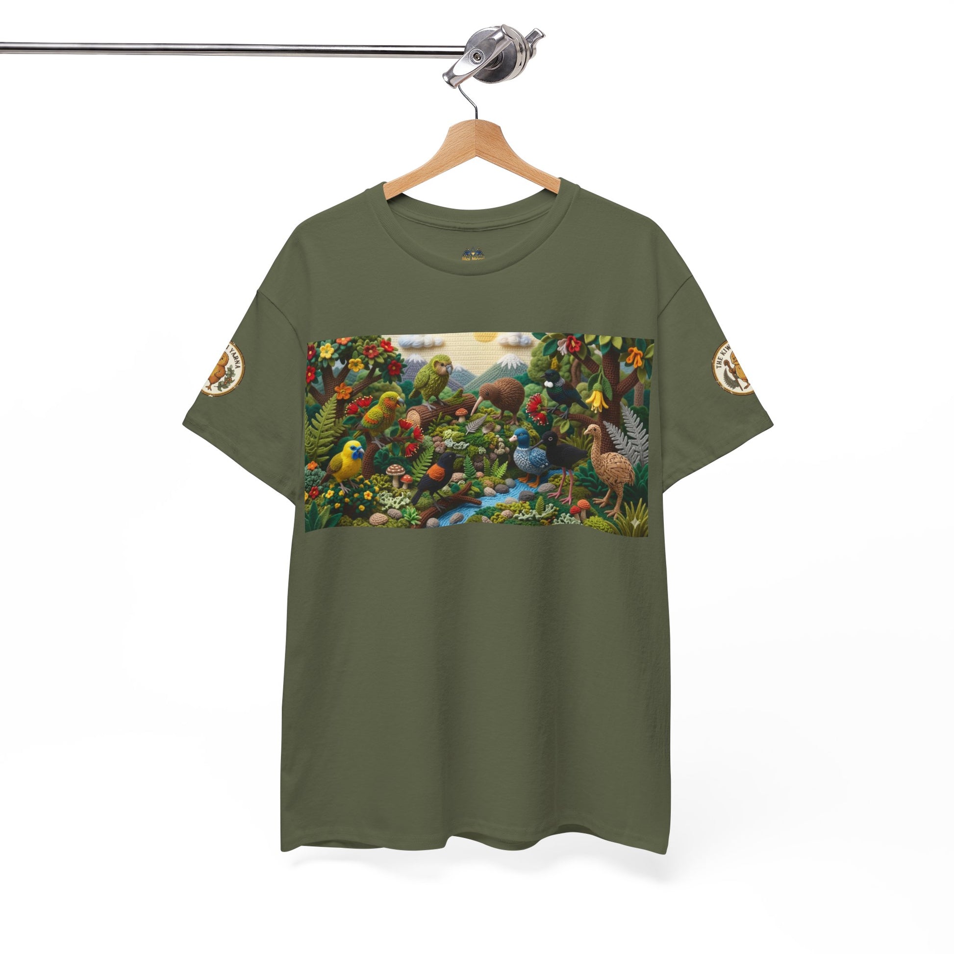 Olive green graphic T-shirt on hanger with bird-and-forest rectangular front panel and sleeve badge