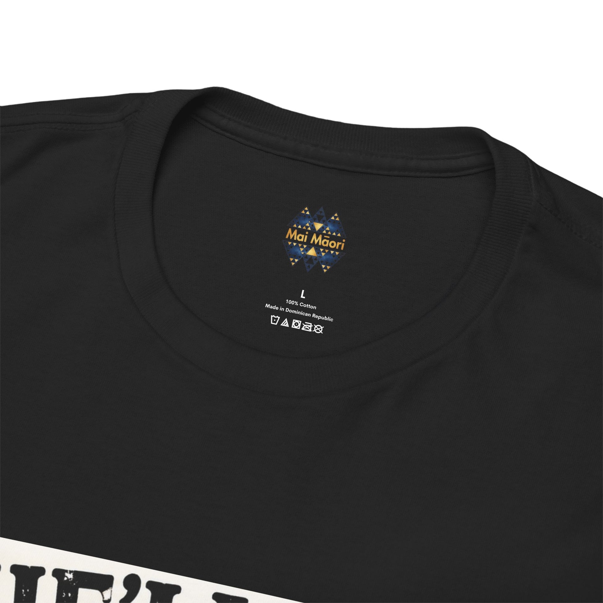 Black T-shirt with small chest logo near neckline and care label below