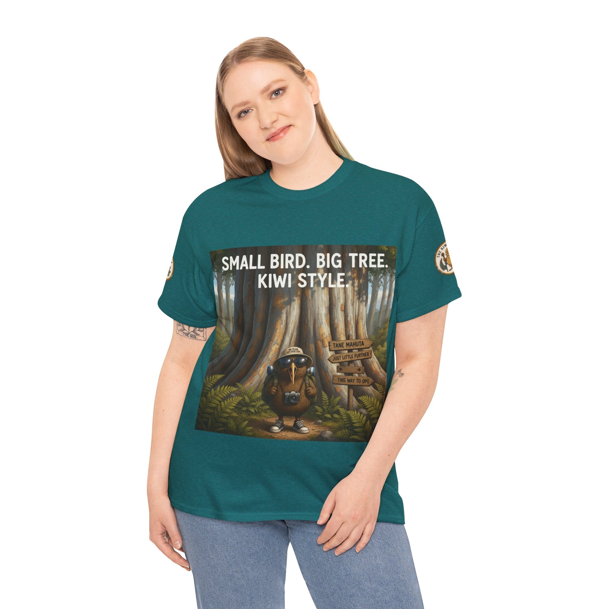Teal graphic T-shirt with front woodland scene and “Kiwi Style” text