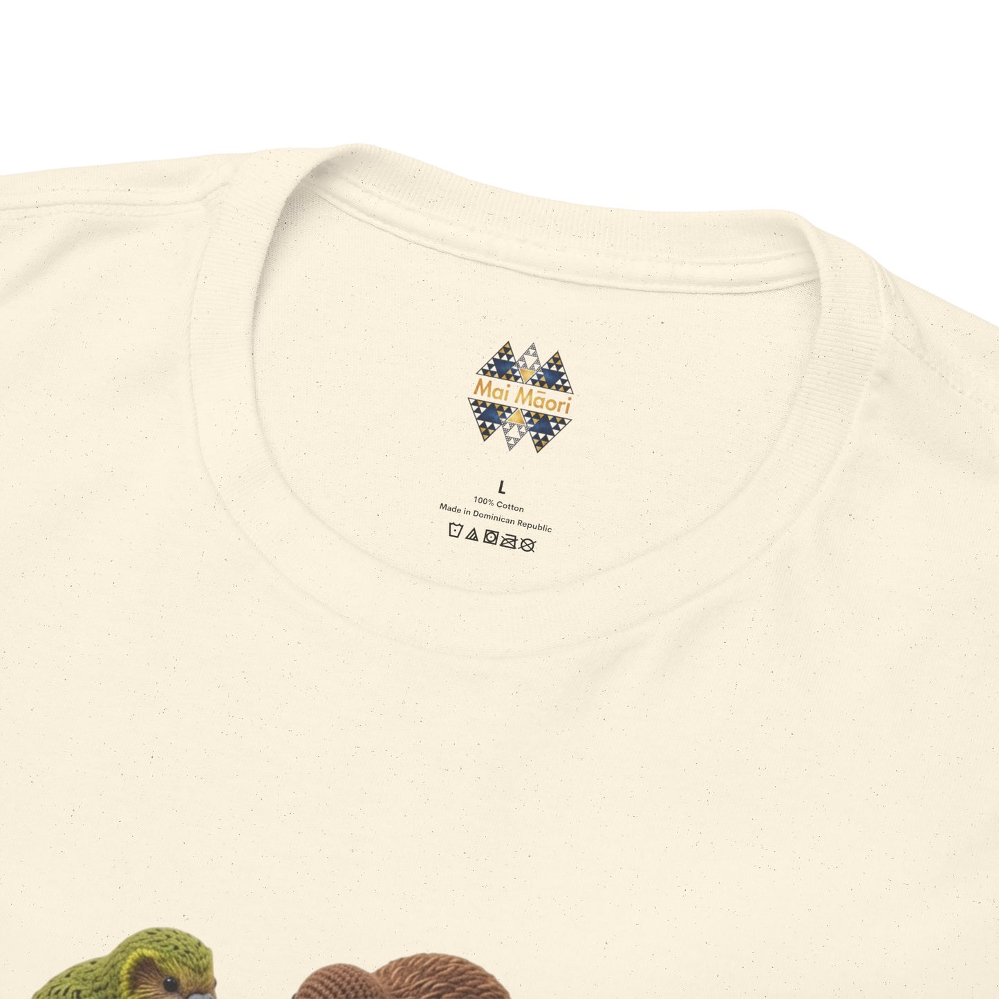 Cream T-shirt back with small colorful logo and printed tags near neckline